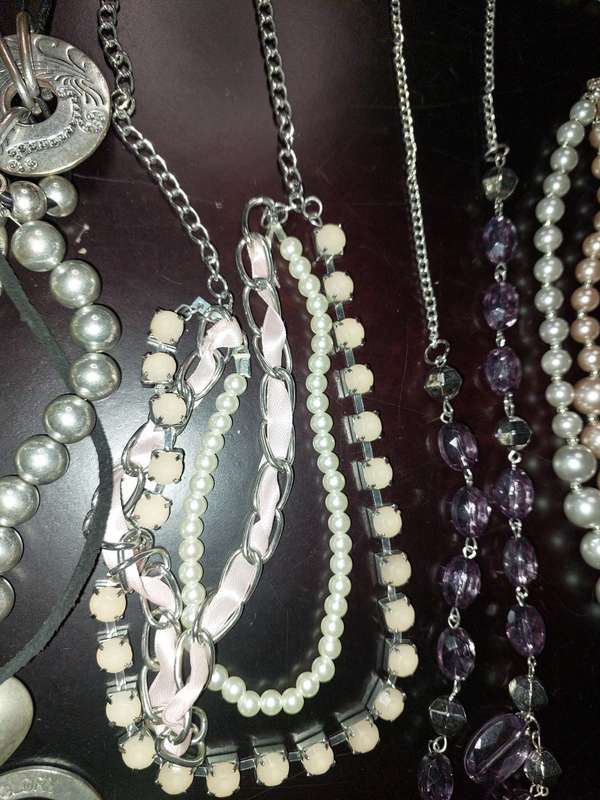 A COLLECTION OF HIGH QUALITY DESIGNER MULTI STRAND COSTUME NECKLACES SOLD AS IS
