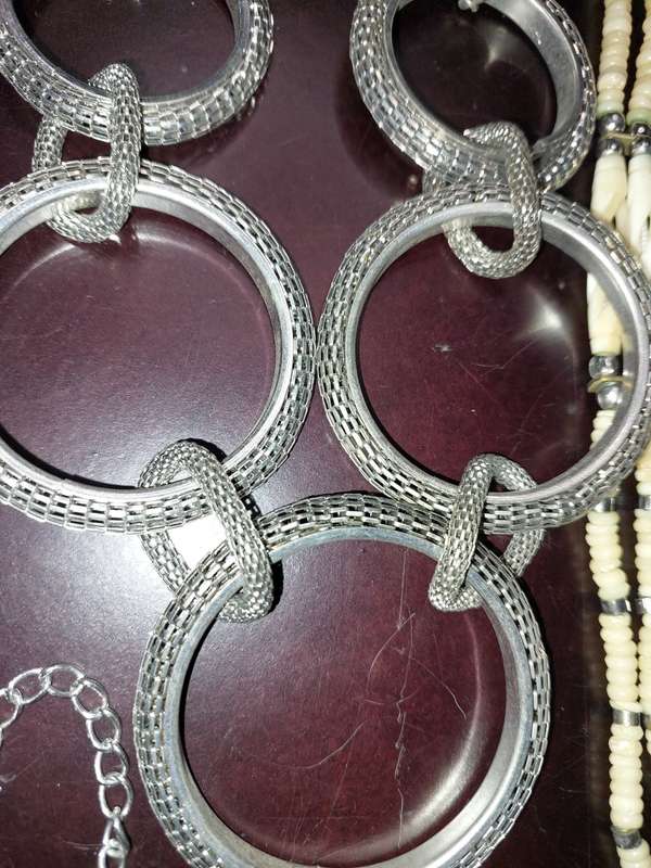 A COLLECTION OF HIGH QUALITY DESIGNER MULTI STRAND COSTUME NECKLACES SOLD AS IS