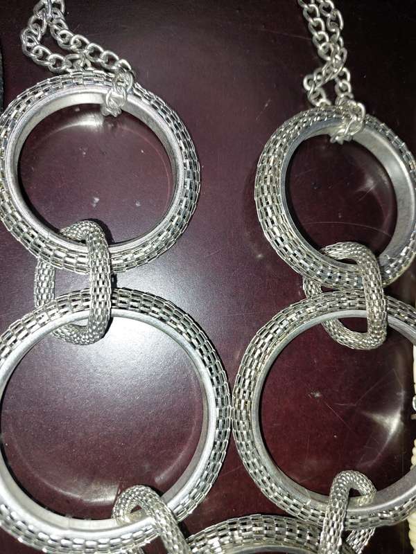 A COLLECTION OF HIGH QUALITY DESIGNER MULTI STRAND COSTUME NECKLACES SOLD AS IS