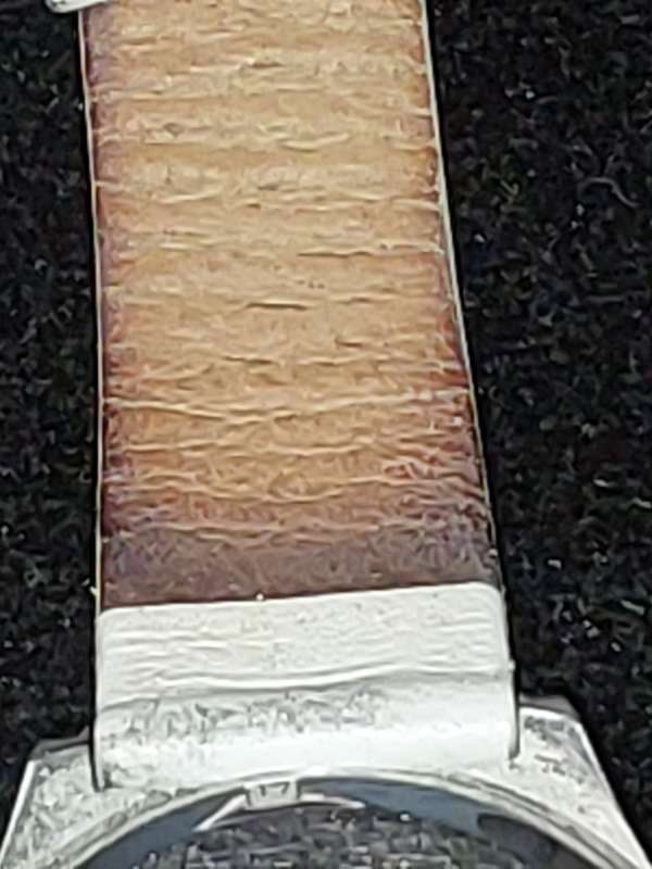 A FOLLI FOLLIE WITH WHITE ENEMAL BAZEL D/D AND WHITE LEATHER BAND