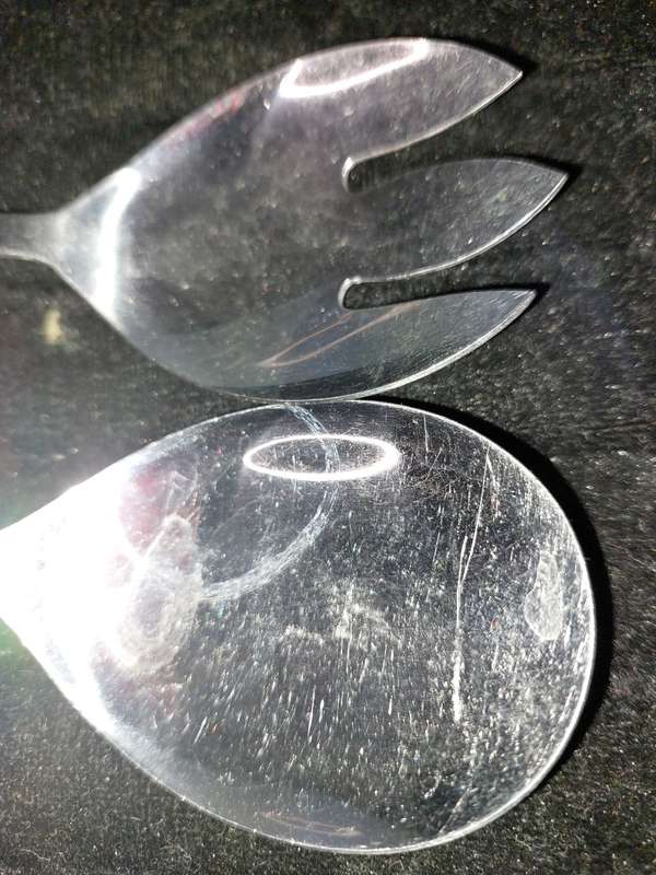 A  SET JAPANESE STAINLESS STEEL AND PERSPECT HANDLE SALAD LADELS SOLD AS IS