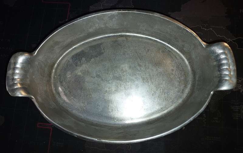 A MIDSIZE CASSEROLE STYLE ALUMINIUM ALLOY SERVING DISH SOLD AS IS