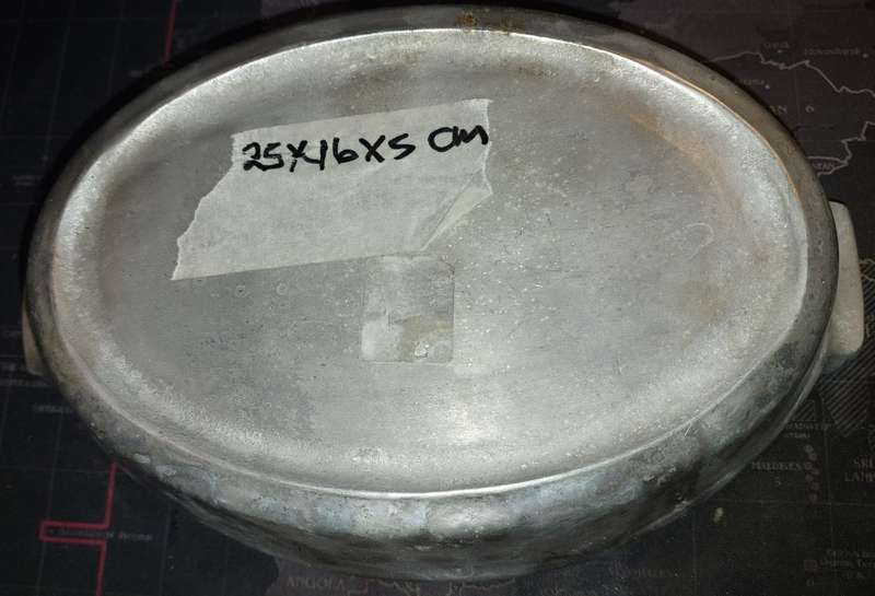A MIDSIZE CASSEROLE STYLE ALUMINIUM ALLOY SERVING DISH SOLD AS IS
