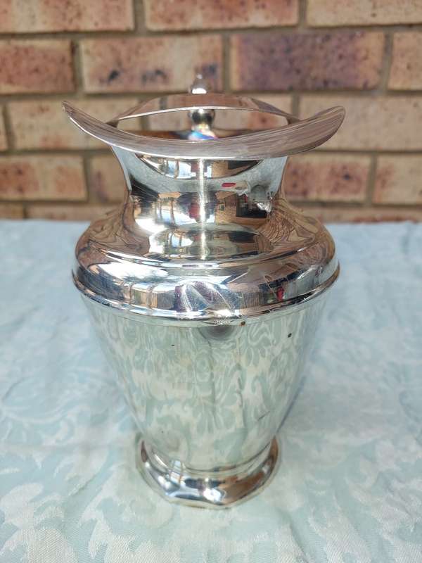 A VINTAGE ROMAN STYLE SILVER PLATED JUG