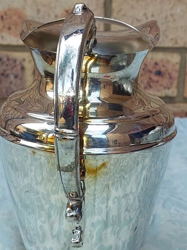 A VINTAGE ROMAN STYLE SILVER PLATED JUG