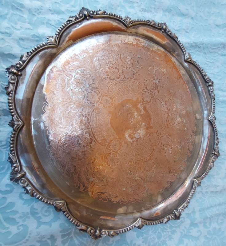 A VICTORIAN DESIGN SILVER PLATED SERVING TRAY SOLD AS IS