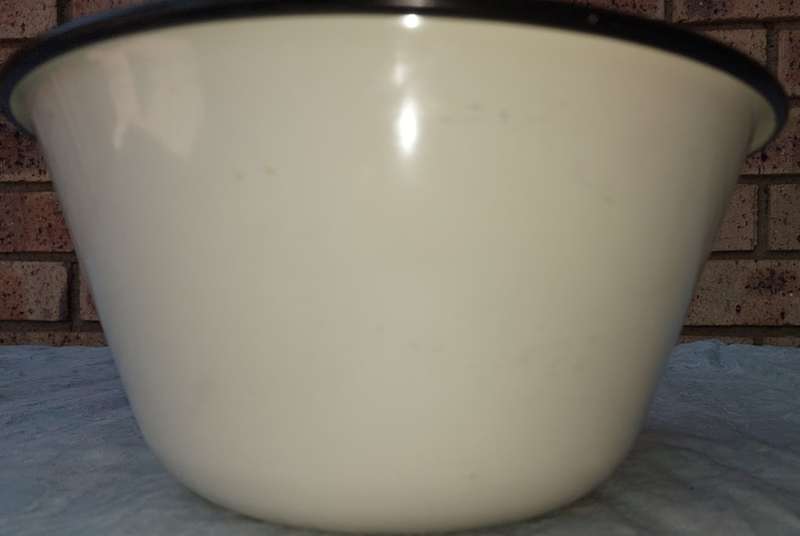 A FARM-STYLE ENAMEL POPCORN BOWL SOLD AS IS