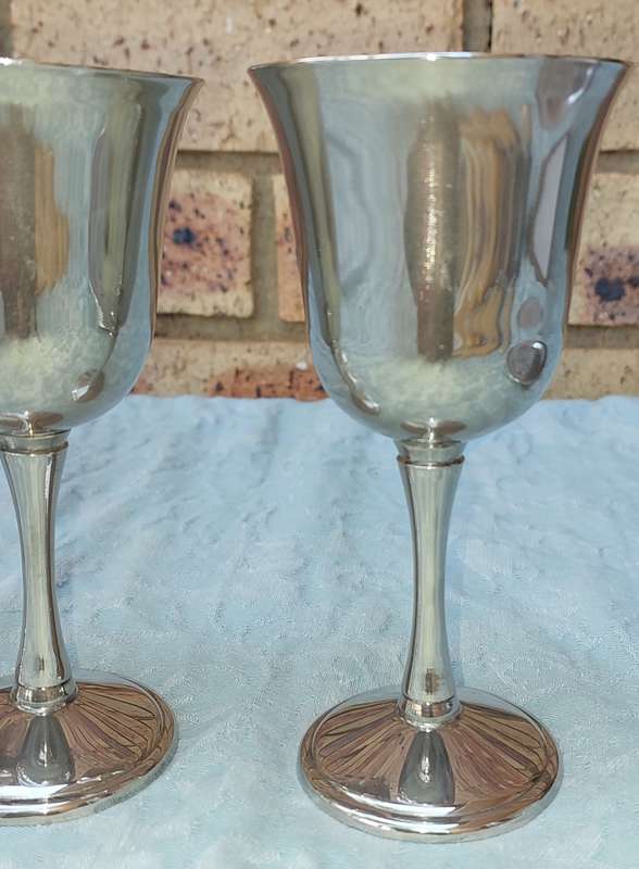 A SET OF FOUR WINE FLUTES SILVER PLATED