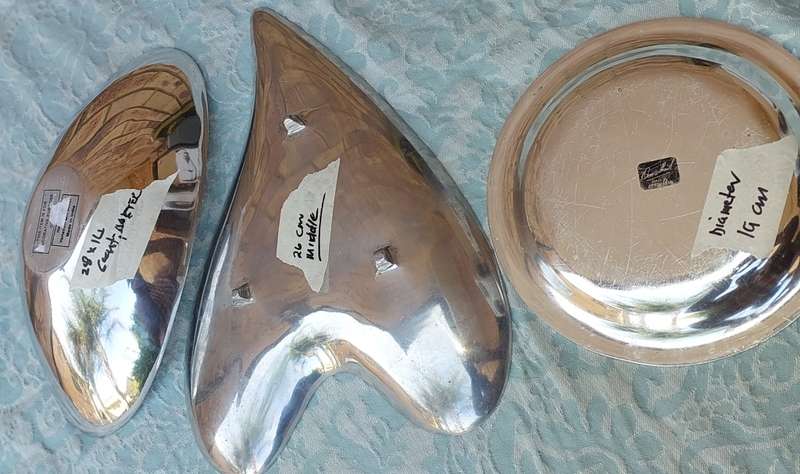 A  COLLECTION OF ALUMINIUM ALLOY PLATTERS  SOLD AS IS