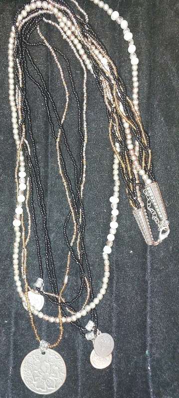 A VINTAGE DESIGNER COLLECTION OF COSTUME NECKLACES SOLD AS IS