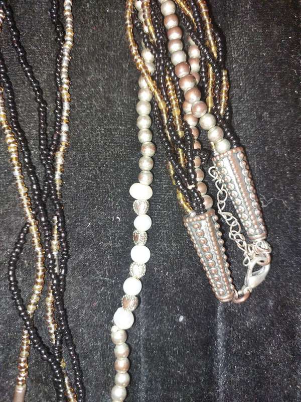 A VINTAGE DESIGNER COLLECTION OF COSTUME NECKLACES SOLD AS IS