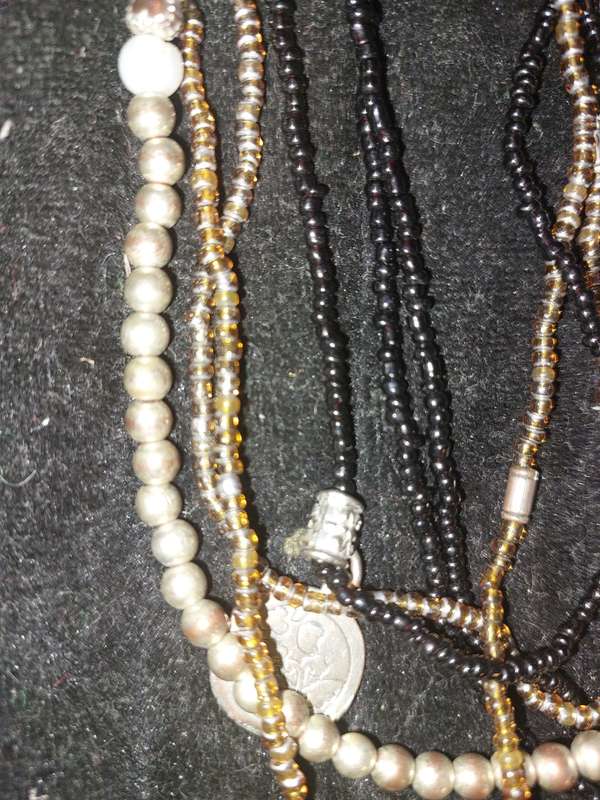 A VINTAGE DESIGNER COLLECTION OF COSTUME NECKLACES SOLD AS IS