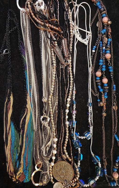 A VINTAGE DESIGNER COLLECTION OF COSTUME NECKLACES SOLD AS IS