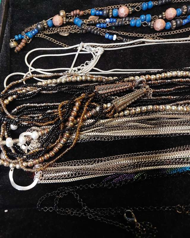 A VINTAGE DESIGNER COLLECTION OF COSTUME NECKLACES SOLD AS IS