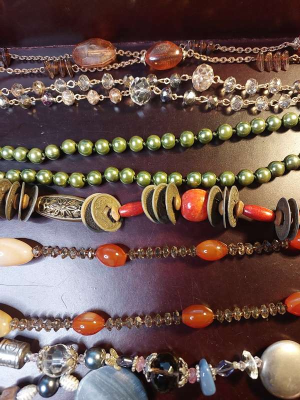 A VINTAGE COLLECTION OF HEAVY BEADED WITH SEMI-PRECIOUS STONES
