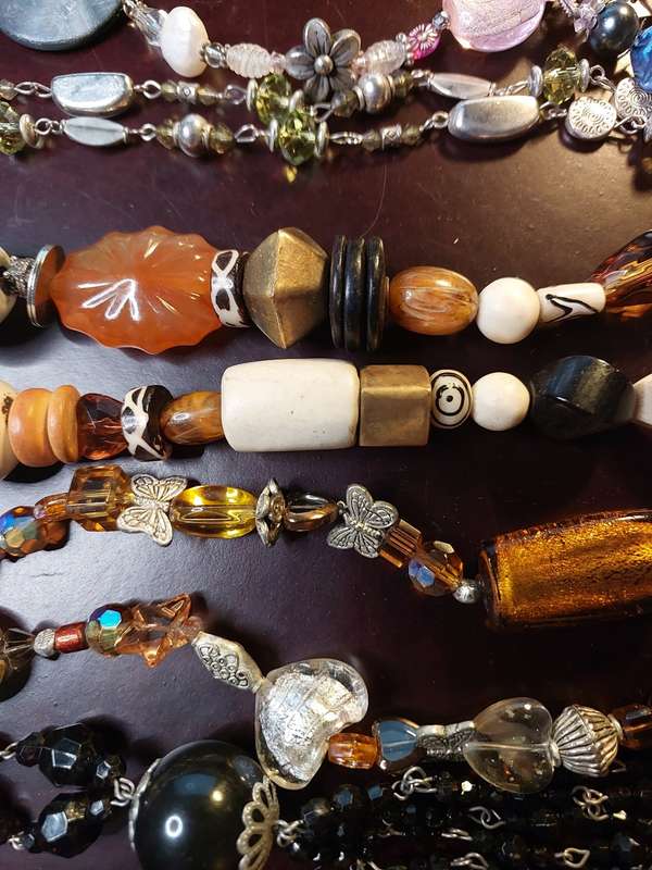 A VINTAGE COLLECTION OF HEAVY BEADED WITH SEMI-PRECIOUS STONES