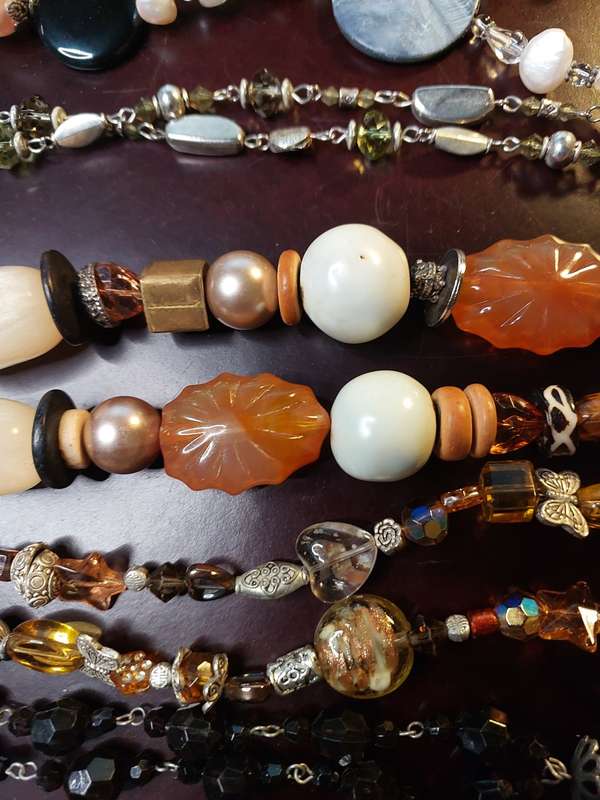A VINTAGE COLLECTION OF HEAVY BEADED WITH SEMI-PRECIOUS STONES