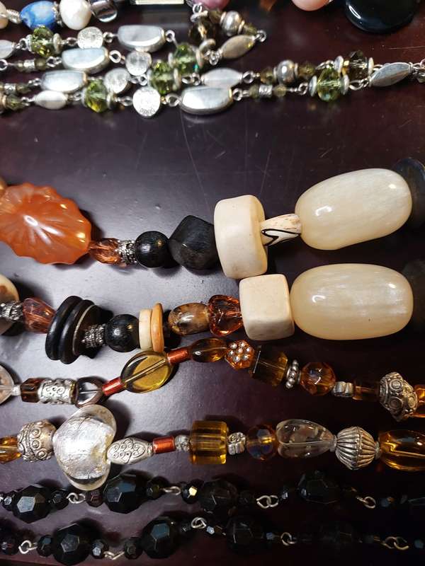 A VINTAGE COLLECTION OF HEAVY BEADED WITH SEMI-PRECIOUS STONES