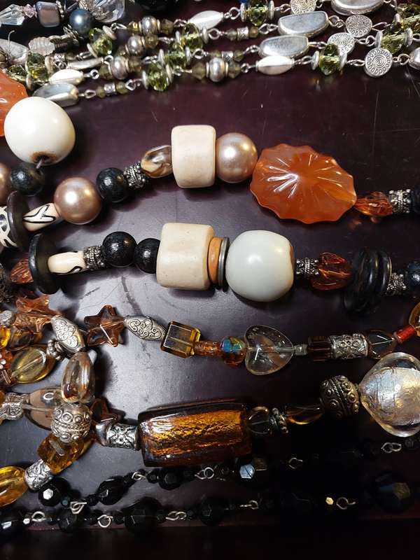 A VINTAGE COLLECTION OF HEAVY BEADED WITH SEMI-PRECIOUS STONES