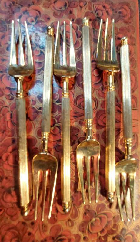 A SET OF SIX VINTAGE  GOLDPLATED COCKTAIL FORKS