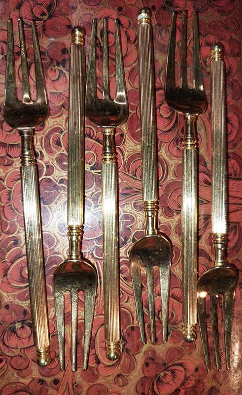 A SET OF SIX VINTAGE  GOLDPLATED COCKTAIL FORKS