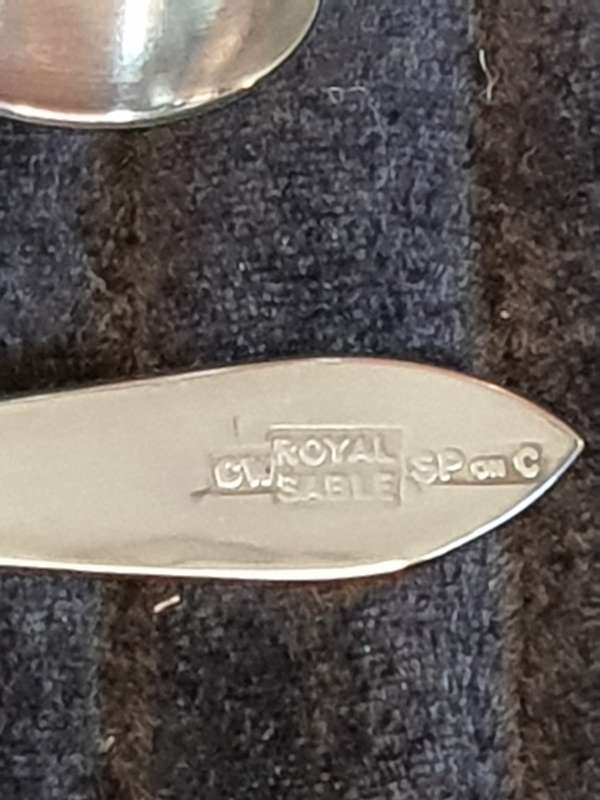 A SILVER PLATED SINGLE EGGCUP, NAPKIN RING AND A SPOON