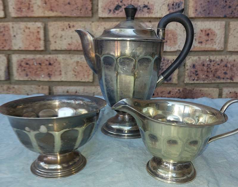 AN ANTIQUE EPNS TEA JUG SET