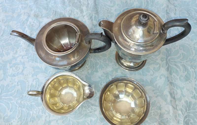 AN ANTIQUE EPNS TEA JUG SET