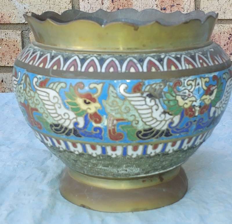 AN ANTIQUE BRASS PLANTER WITH ORNATE DESIGN SOLD AS IS