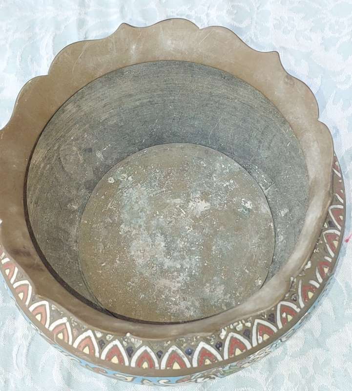 AN ANTIQUE BRASS PLANTER WITH ORNATE DESIGN SOLD AS IS