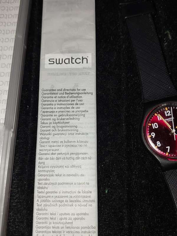 A VINTAGE SWATCH WATCH WITH ITS PAPERWORK AND ORIGINAL BOX SOLD AS IS NOT TESTED