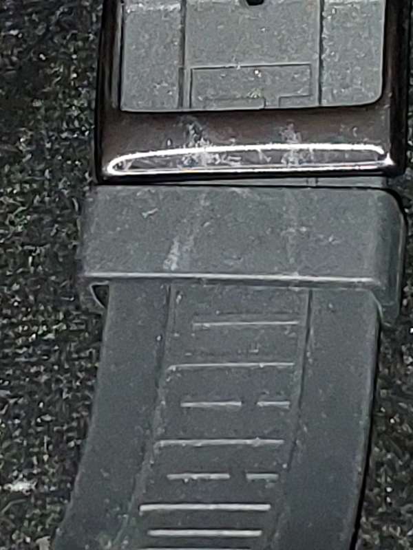 A Puma sports watch take pole position black with a rubber band