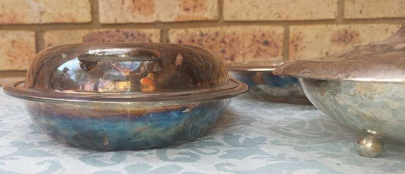A COLLECTION OF ANTIQUE SILVER PLATED TURINES AND A SERVING TRAY