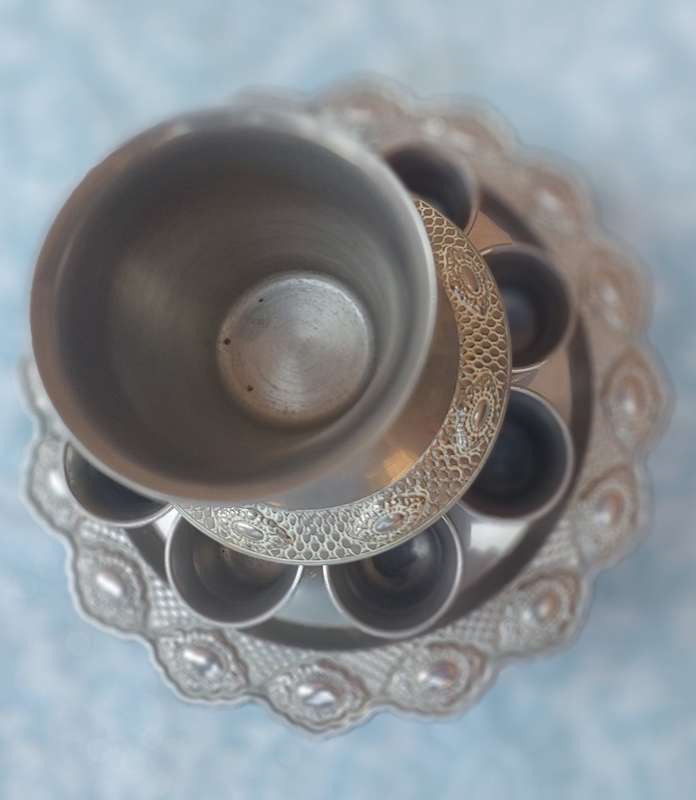 A COMPLETE ORNATE SILVER PLATED KIDDUSH CUP SET