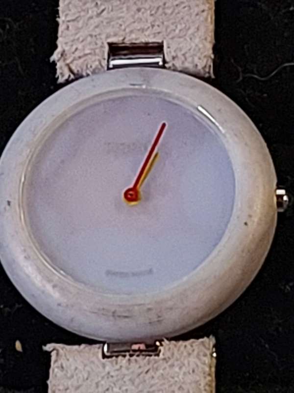 A RARE TISSOT GREY STONE WATCH