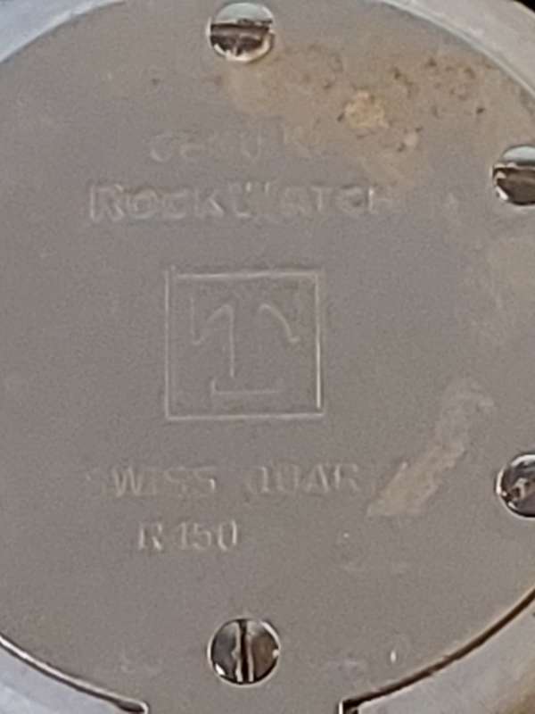 A RARE TISSOT GREY STONE WATCH