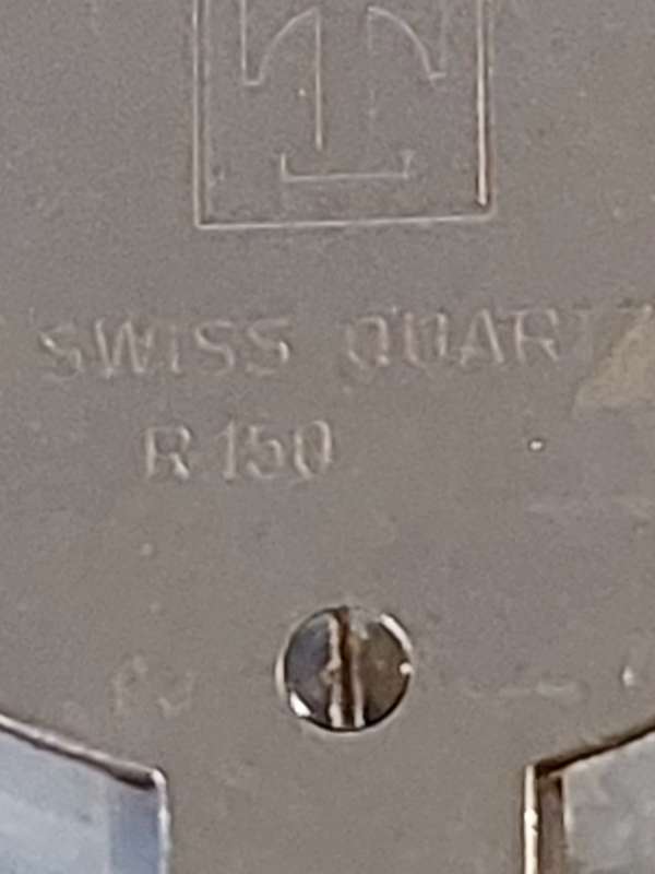 A RARE TISSOT GREY STONE WATCH