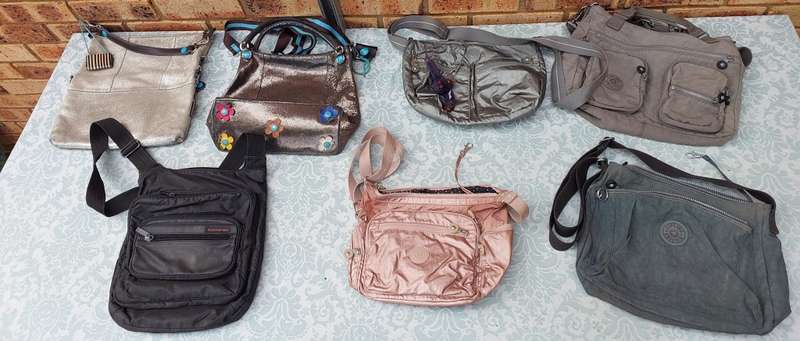 A COLLECTION OF KIPLING AND GABS HAND BAGS SOLD AS IS