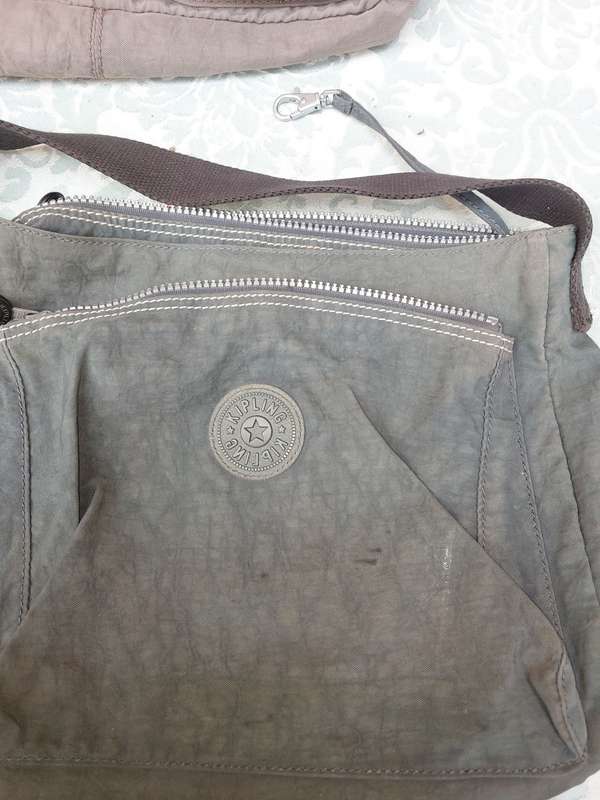 A COLLECTION OF KIPLING AND GABS HAND BAGS SOLD AS IS