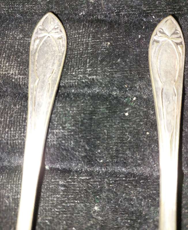 A VINTAGE SET TEASPOONS SOLD AS IS