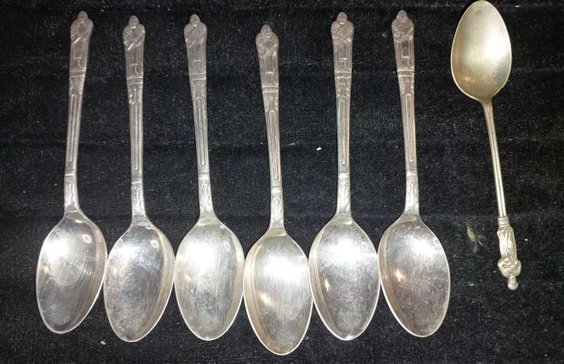 A COLLECTION OF 7 FIGURAL EPNS TEASPOONS