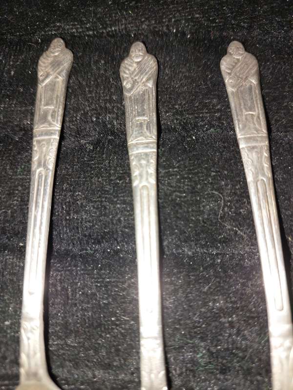 A COLLECTION OF 7 FIGURAL EPNS TEASPOONS
