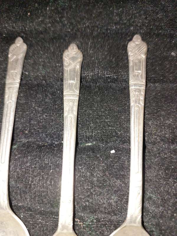 A COLLECTION OF 7 FIGURAL EPNS TEASPOONS