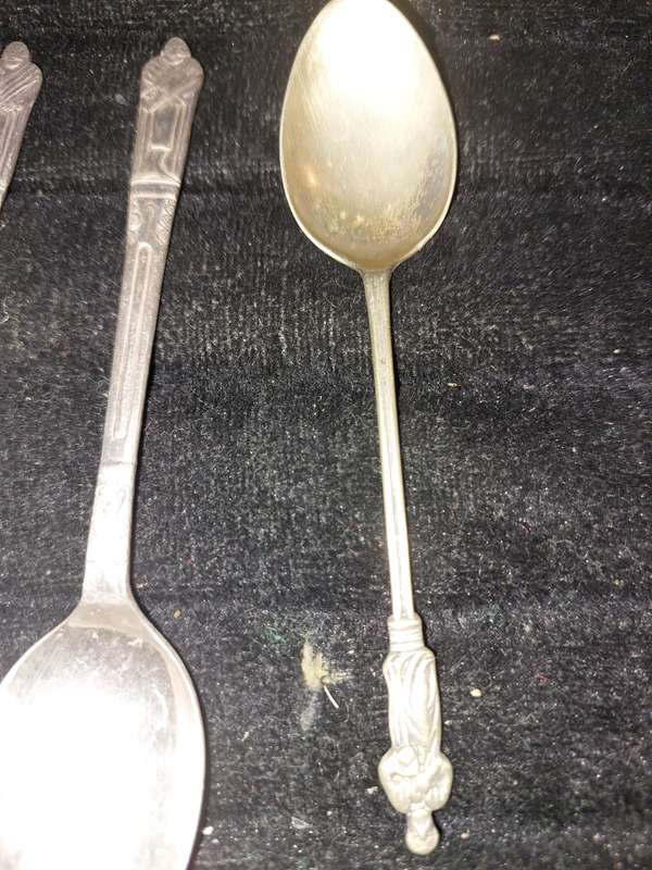 A COLLECTION OF 7 FIGURAL EPNS TEASPOONS