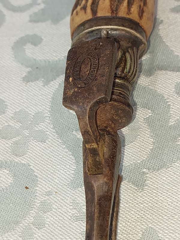 AN ANTIQUE ROAST FORK SOLD AS IS