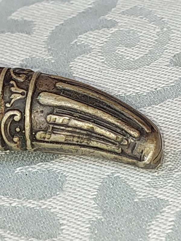 AN ANTIQUE ROAST FORK SOLD AS IS