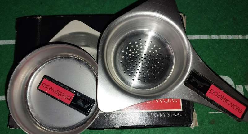 A POINTER WARE TEA STRAINER