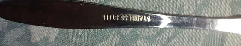 A VINTAGE SET OF 5 TEASPOONS SOLD AS IS