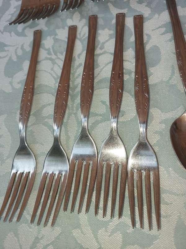 A 34-PIECE ALFA STAINLESS STEEL CUTLERY SET