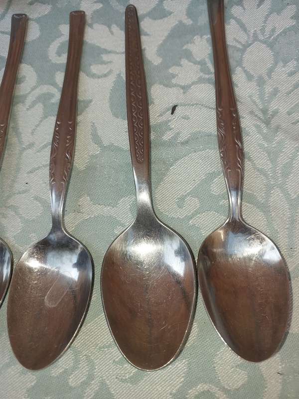 A 34-PIECE ALFA STAINLESS STEEL CUTLERY SET
